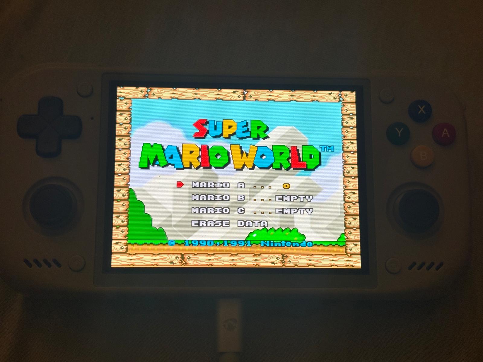 Super Mario World on the Nova: scanlines from crt-guest-advanced at an exact 4x, with the 32-pixel bars